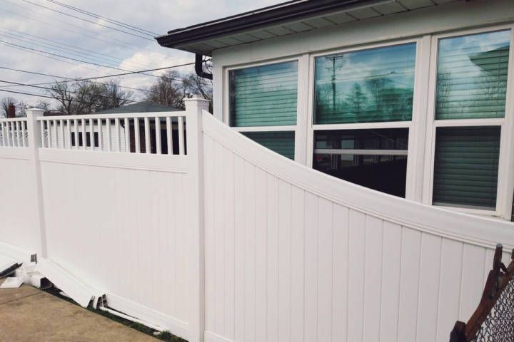 Fence Is In Front Of A House With A Window — Warren, MI — Kimberly Fence & Supply