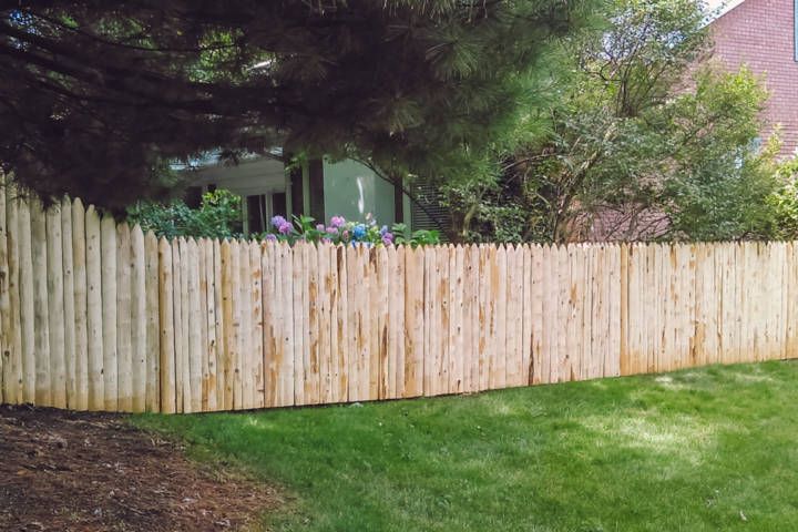 Rustic White Cedar Stockade Fence With Transition — Warren, MI — Kimberly Fence & Supply