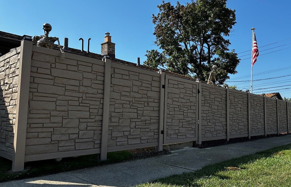 Fence With A Gate Is Sitting Next To A Sidewalk — Warren, MI — Kimberly Fence & Supply