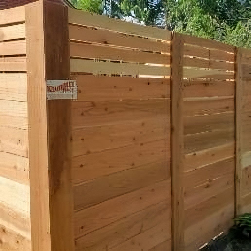 Fence With A Sign On The Side Of It — Warren, MI — Kimberly Fence & Supply