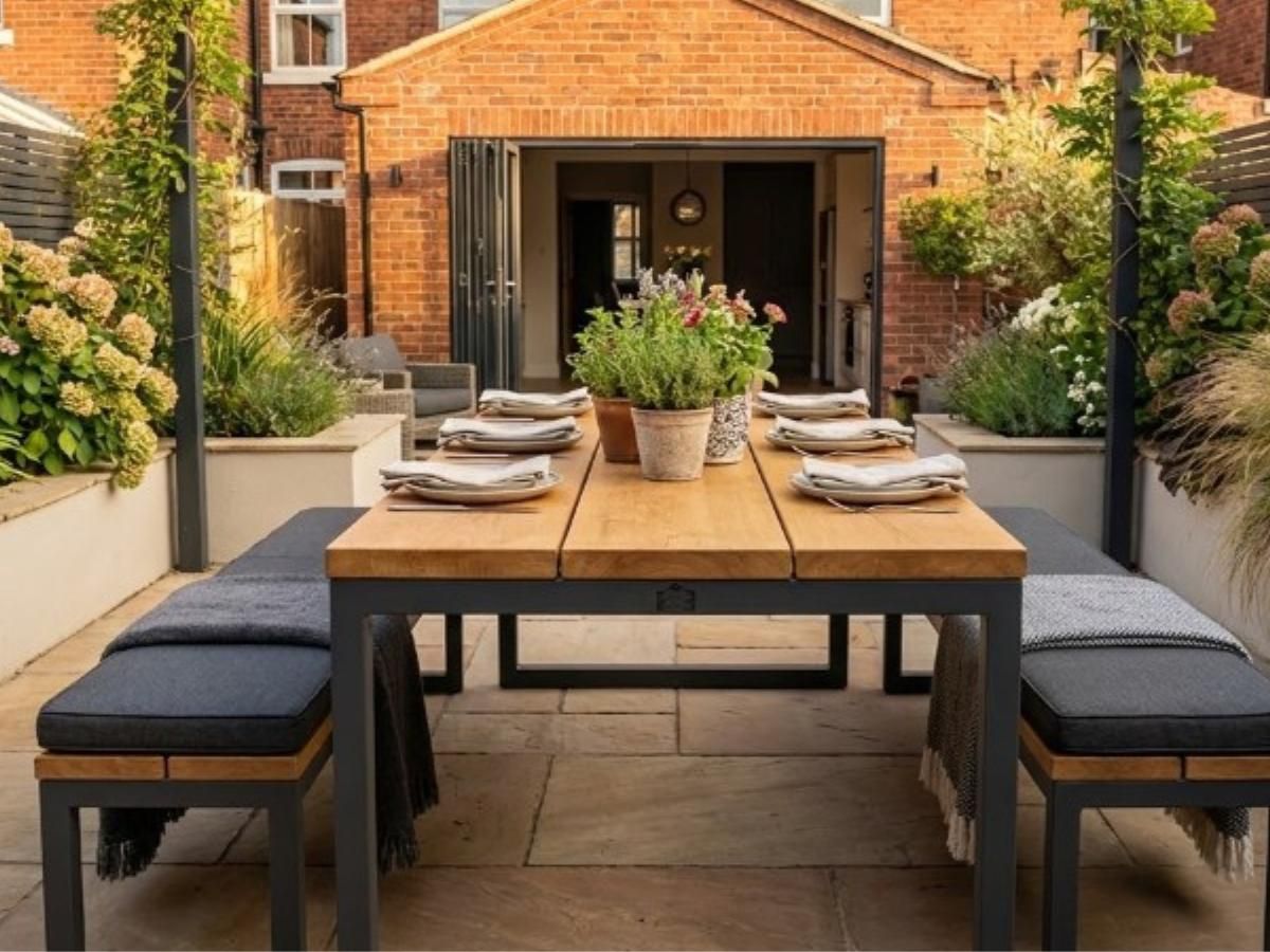 Bespoke metal and wood garden furniture including dining table and benches in Nottingham patio creating outdoor living space