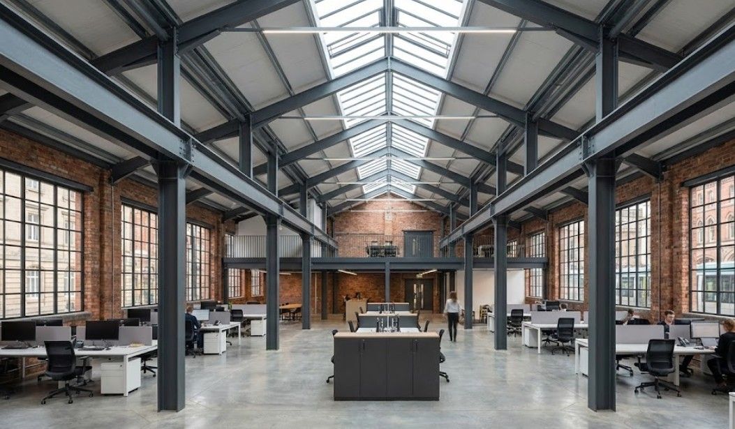 Completed steel portal frame building interior in Nottingham showing clear span commercial space with exposed structural framework