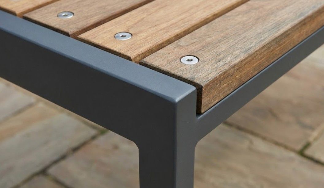 Detail of bespoke metal and wood garden table construction showing quality materials and craftsmanship in Nottingham-made outdoor furniture