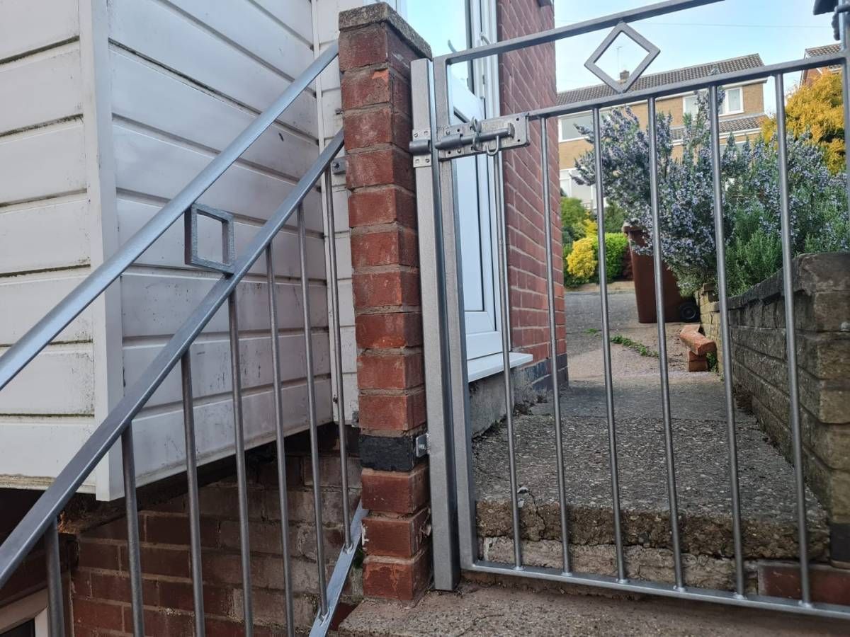 Nottingham Metalworks stainless steel handrail with matching gate