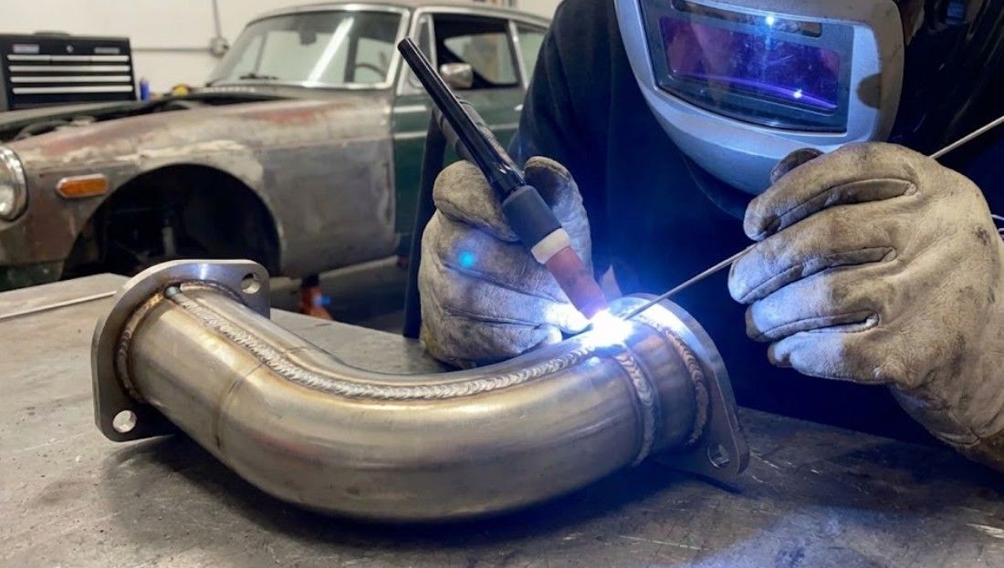 Professional TIG welding of custom automotive component for classic car in Nottingham workshop