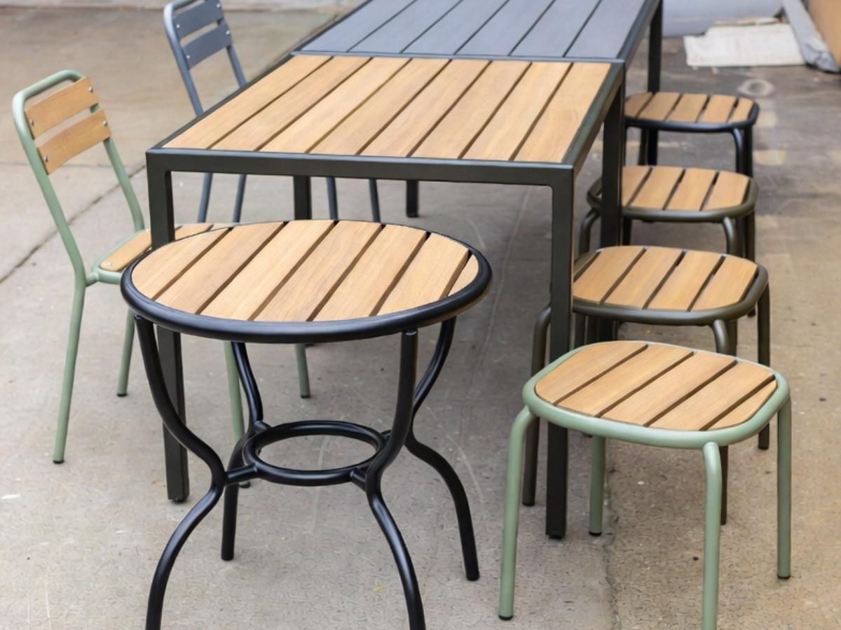 Range of bespoke metal garden tables showing different sizes from compact bistro tables to large outdoor dining tables made in Nottingham