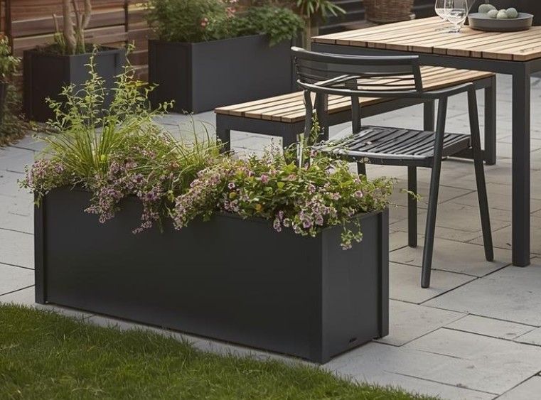 All metal planter finished in anthracite grey powder coat finish in Nottingham garden