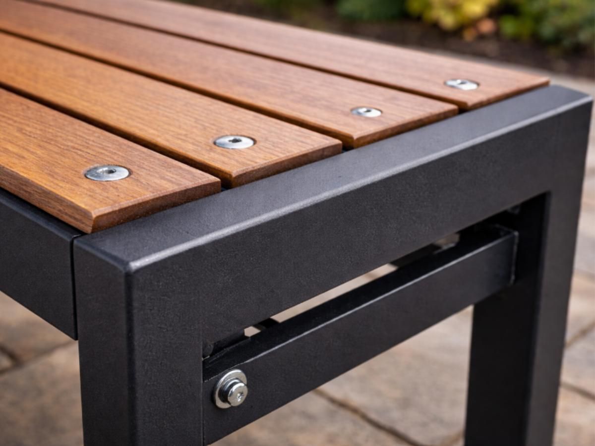 Construction detail of bespoke metal garden bench showing steel frame, timber slats and quality stainless steel fixings in Nottingham fabrication