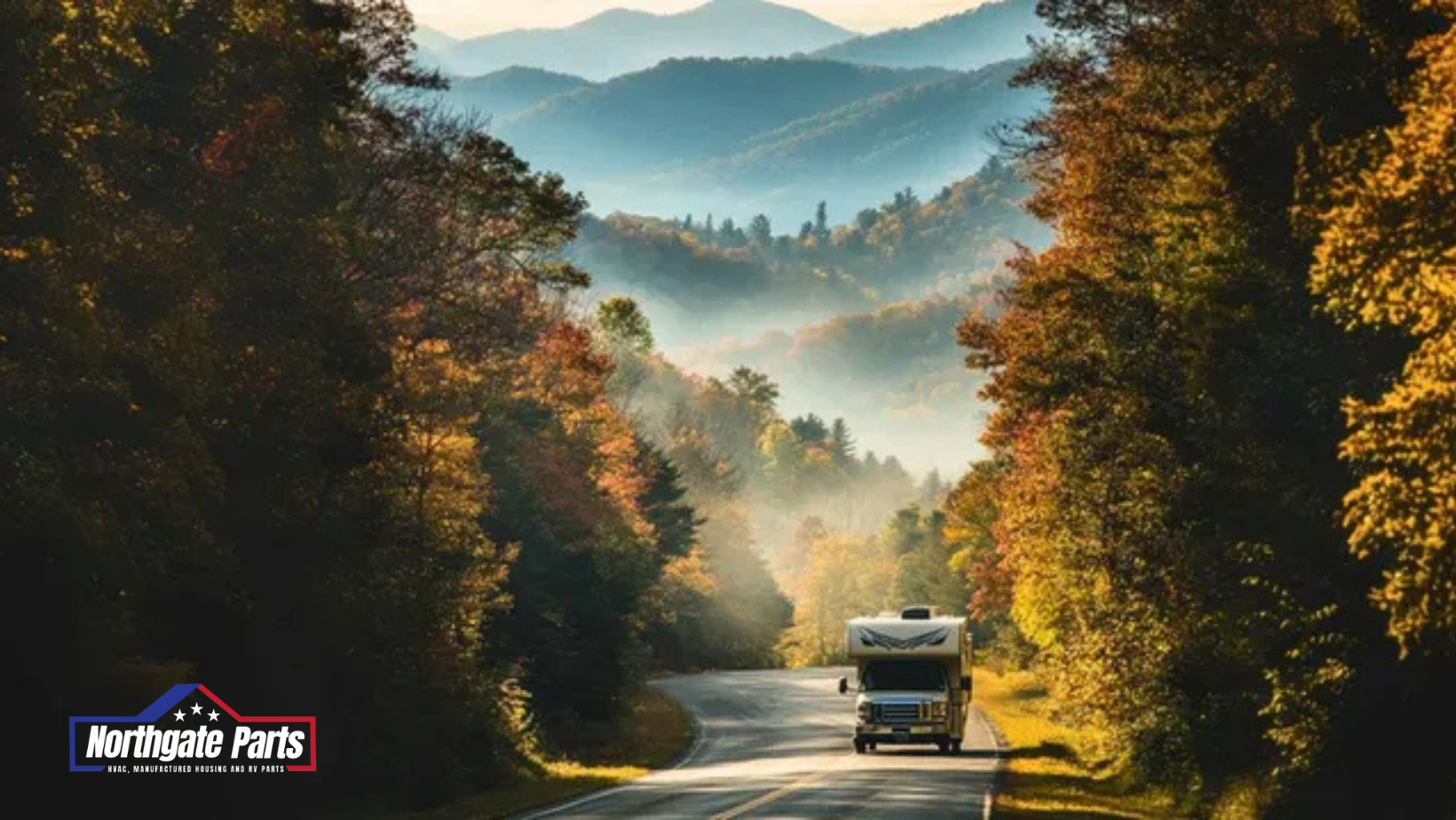 A rv is driving down a mountain road surrounded by trees.