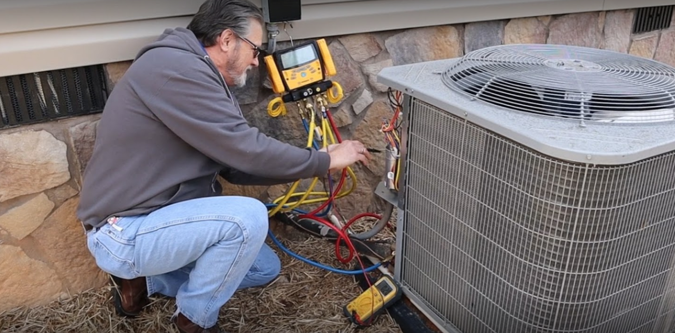 Northgate Parts HVAC Technician working on HVAC system for mobile home owner