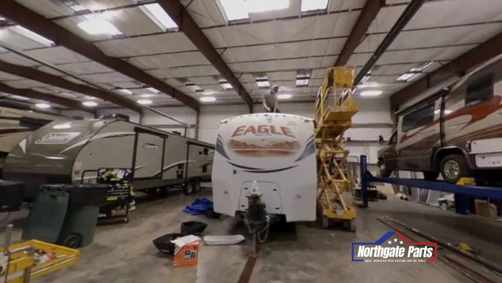 A rv is being repaired in a garage.