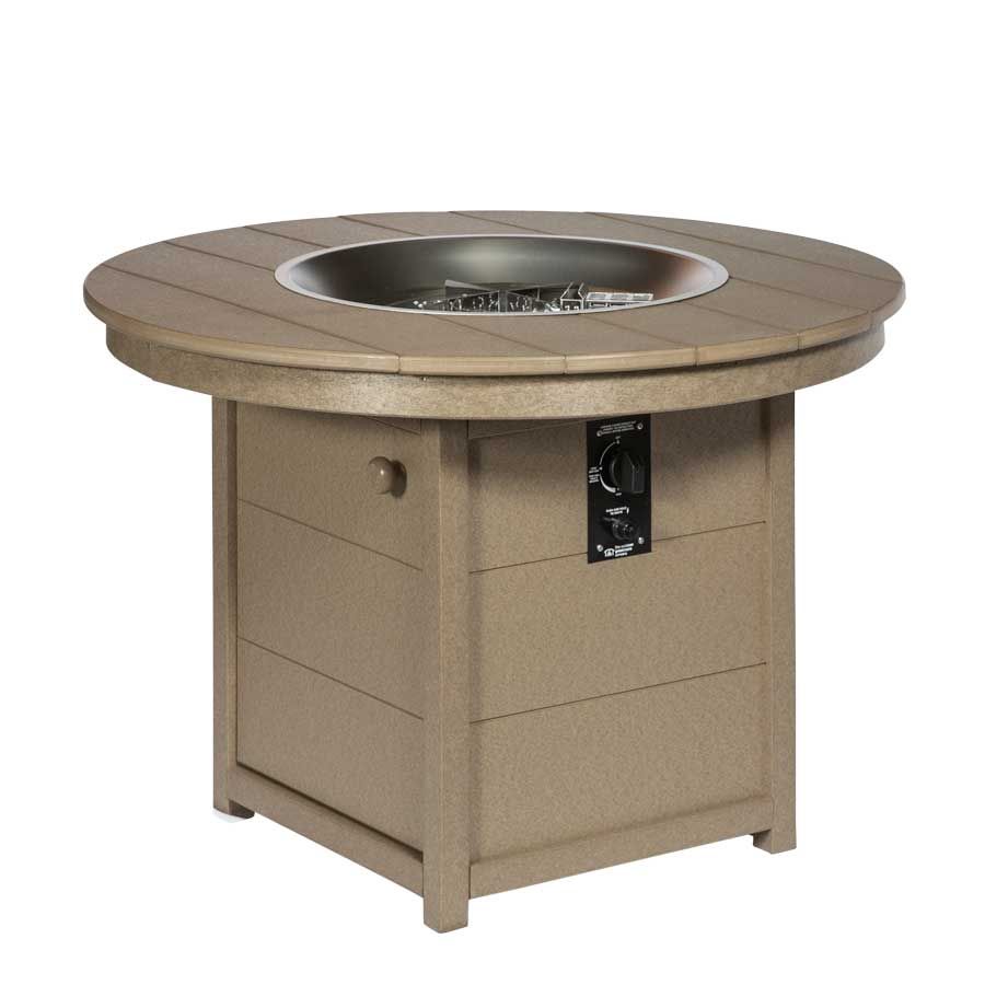 A round fire pit with a stainless steel bowl in the middle A round fire pit with a stainless steel bowl in the middle