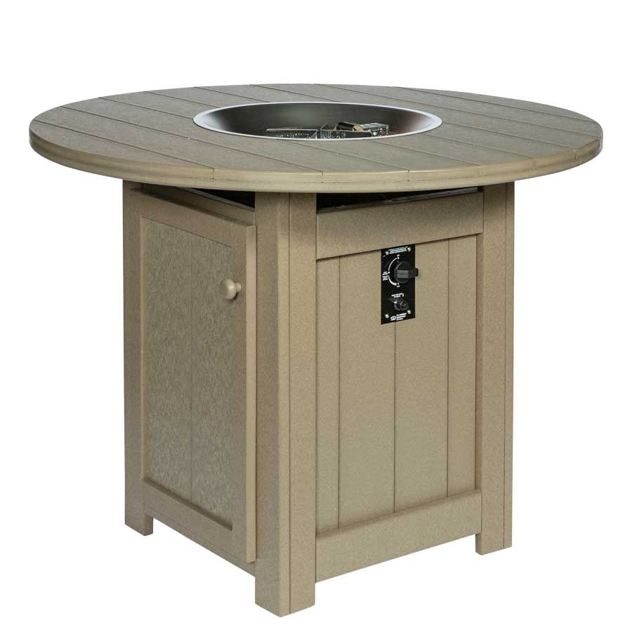 A round wooden table with a fire pit in the middle A round wooden table with a fire pit in the middle