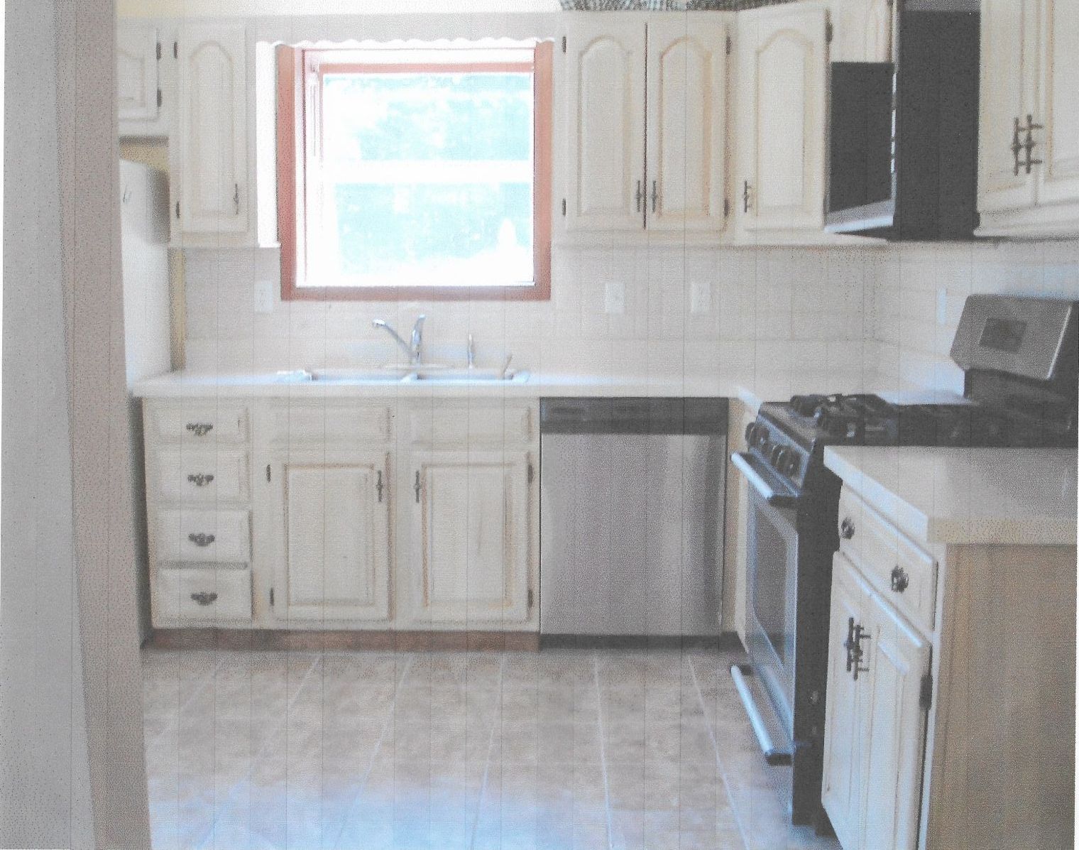 A person is painting a wall with a paint roller.