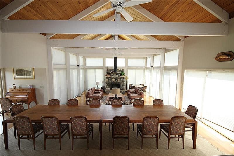 A large room with a table and chairs in it