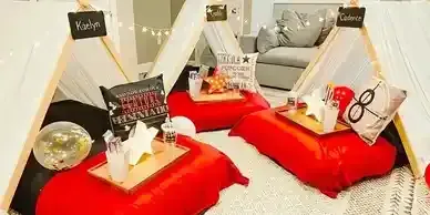 Two teepees are sitting on the floor in a living room.