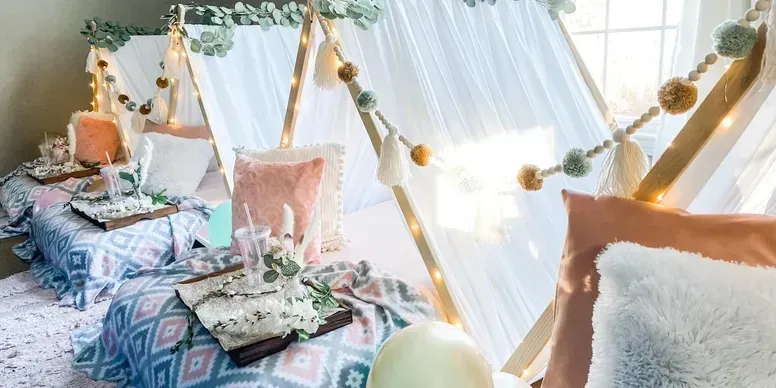 A couple of teepees sitting next to each other in a room.