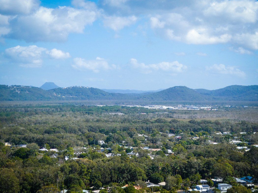 An Aerial View of a Town With a Forest and Mountains — Glittering Cleaning Service in Mount Low, QLD
