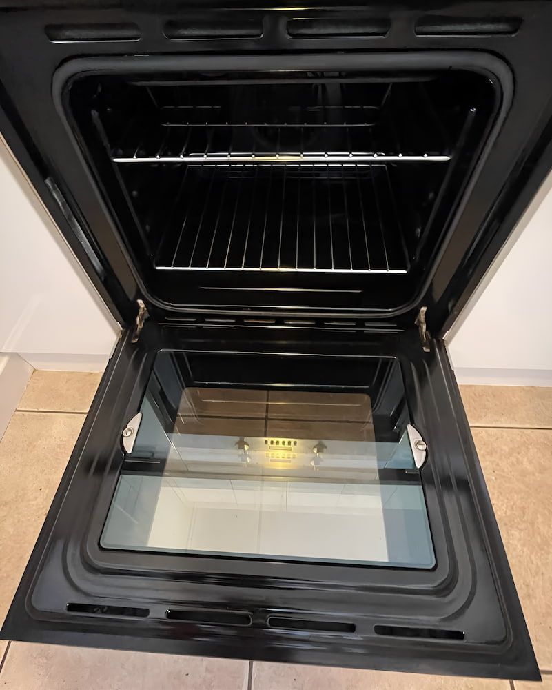 The Inside Of An Oven With The Door Open — Glittering Cleaning Service In Townsville, QLD
