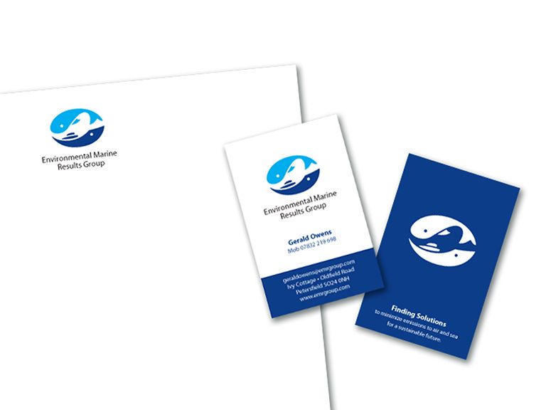 A blue and white business card with a whale on it
