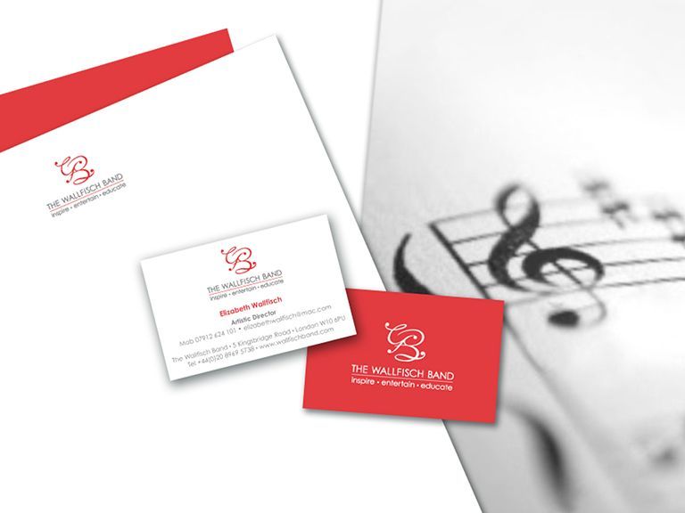 A red and white business card with a treble clef on it
