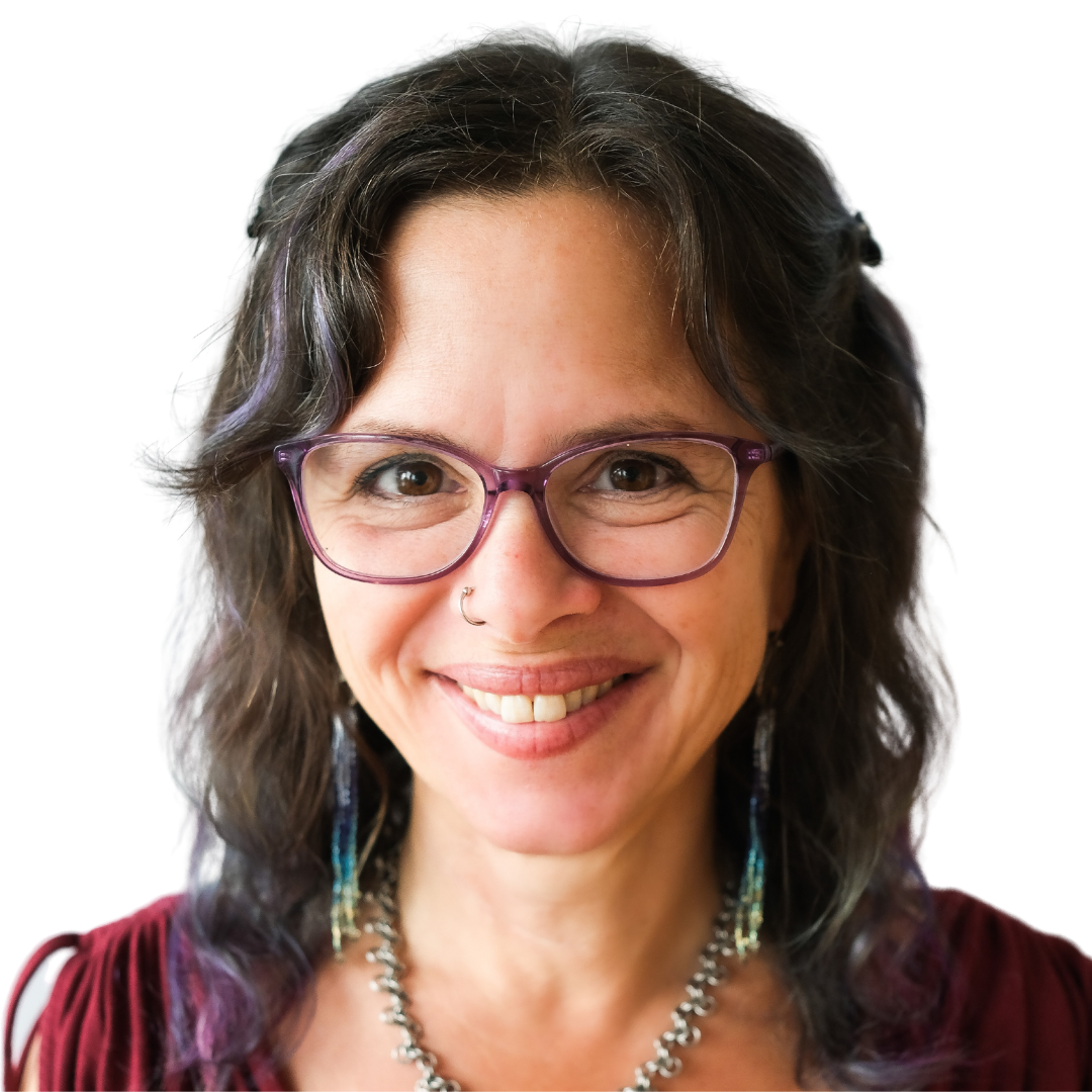 A woman wearing glasses and a necklace smiles for the camera