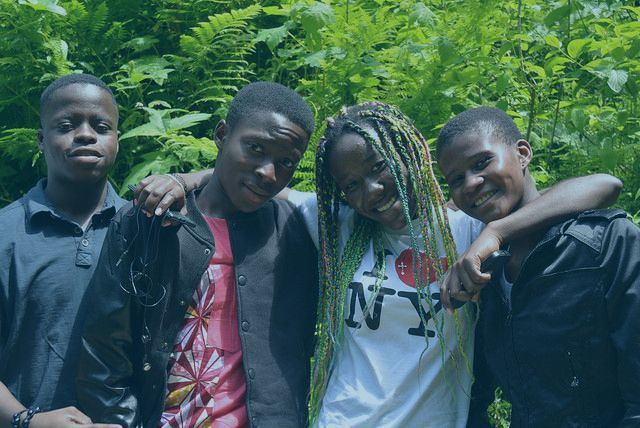 A group of young people are posing for a picture together.