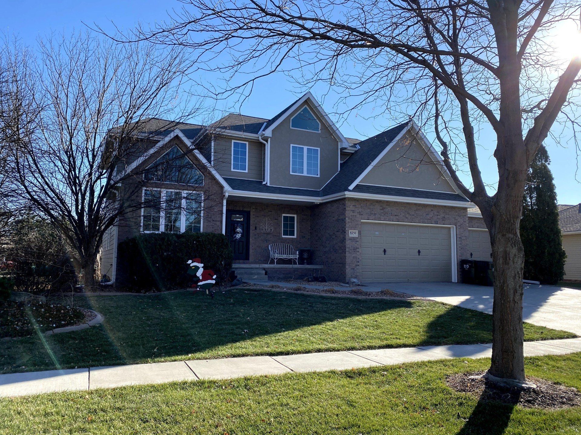 A large house with a tree in front of it