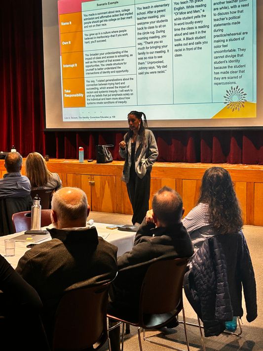 Milyna Phillips  giving a presentation to a group of people