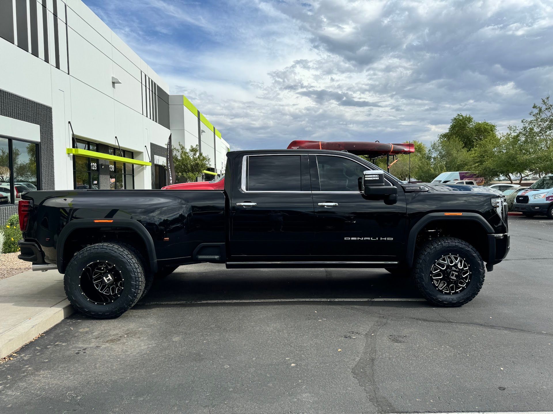 Black Lifted Truck Parked In Front Of The Shop | G & M Motorsports