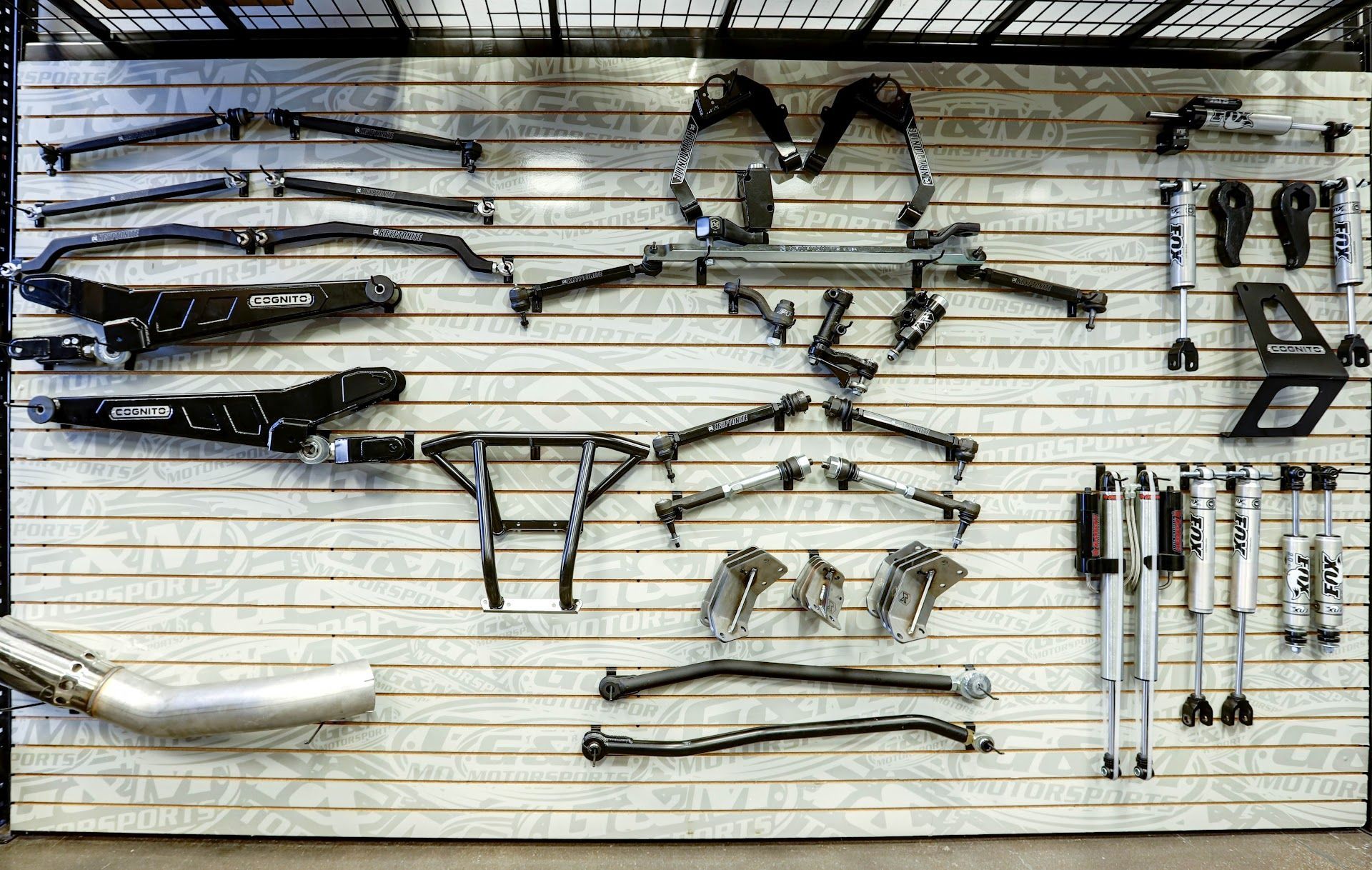 Suspension Components And Tools Displayed On Wall Rack | G & M Motorsports