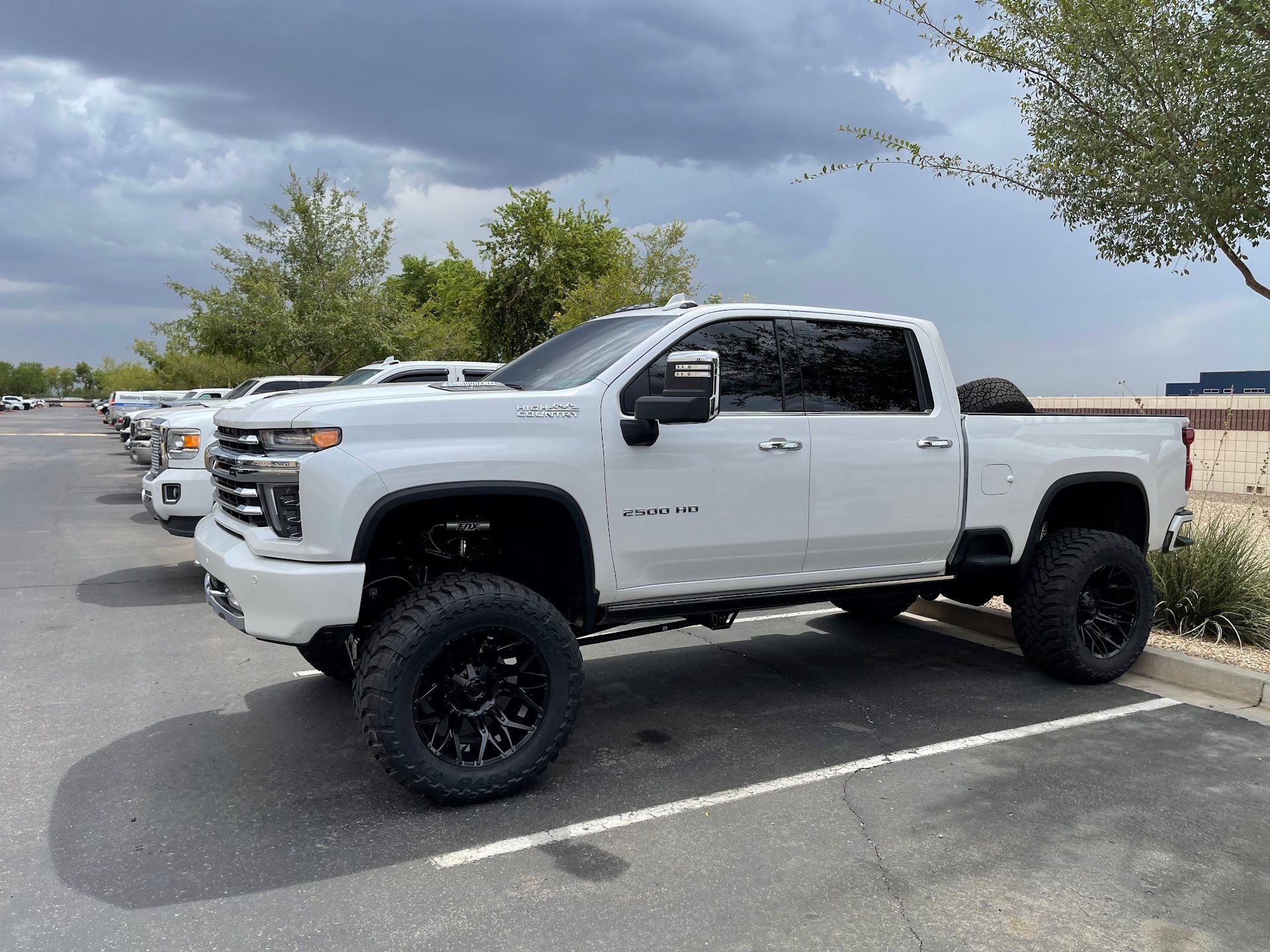 Lifted White Chevrolet Silverado Parked Outdoors | G & M Motorsports