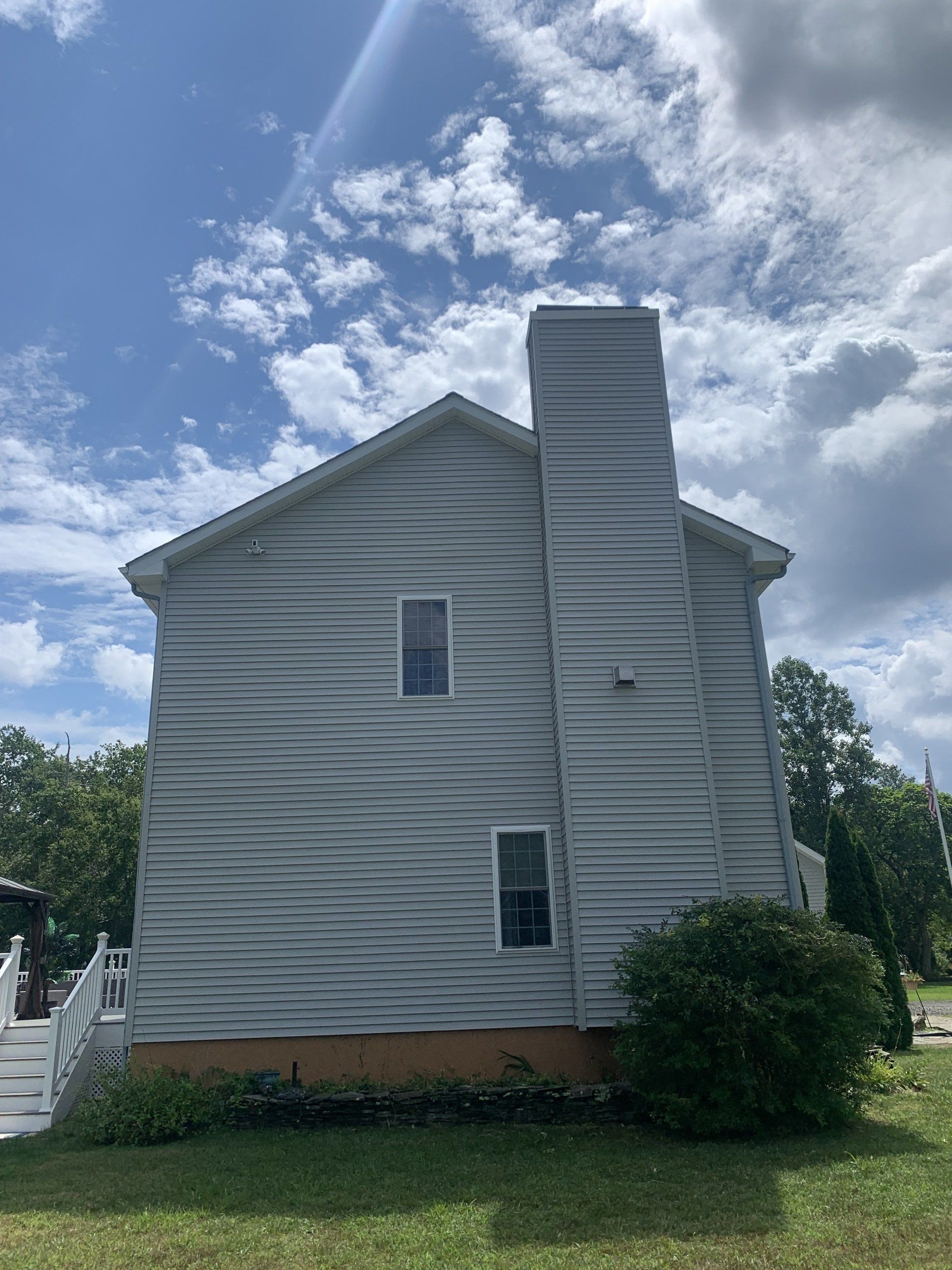 Power washing a house