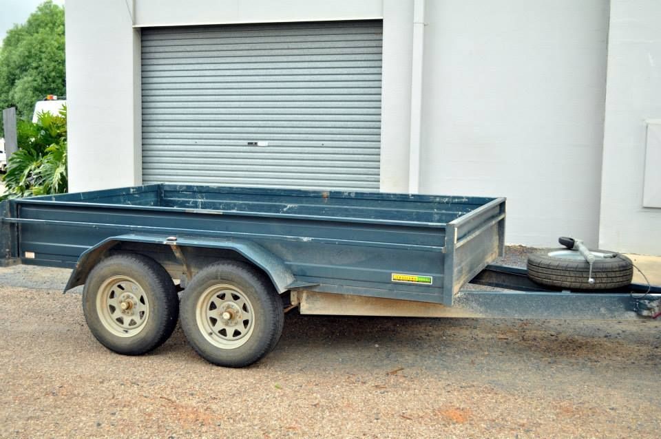 A Trailer is Parked in Front of a Garage Door — Locqal Car Truck Trailer Rentals in Emerald, QLD