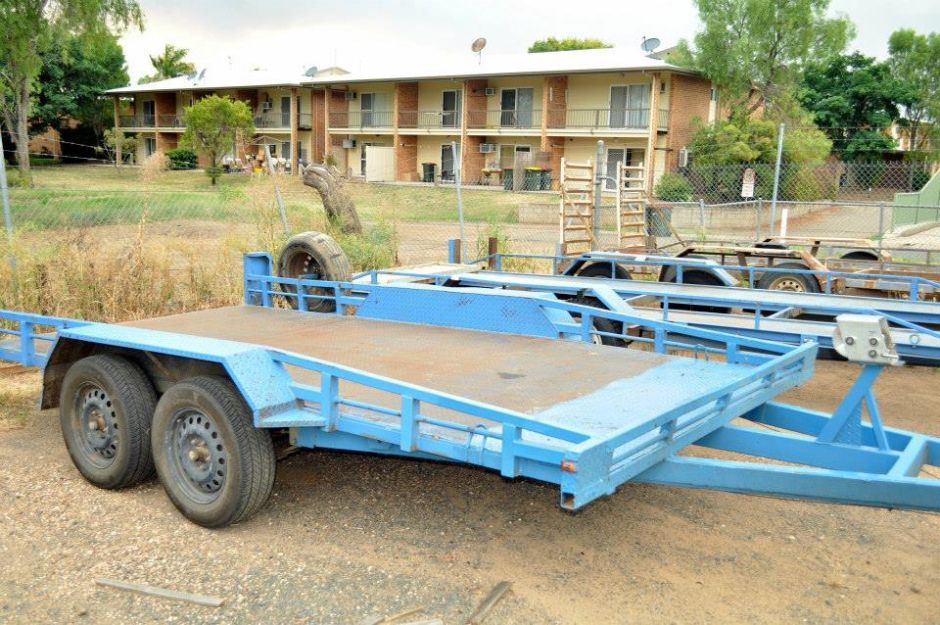 A Blue Trailer is Parked in Front of a Building — Locqal Car Truck Trailer Rentals in Emerald, QLD