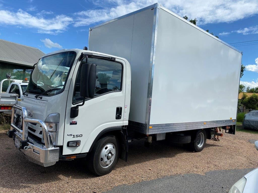 A White Box Truck Is Parked in A Gravel Lot — Locqal Car Truck Trailer Rentals in Emerald, QLD