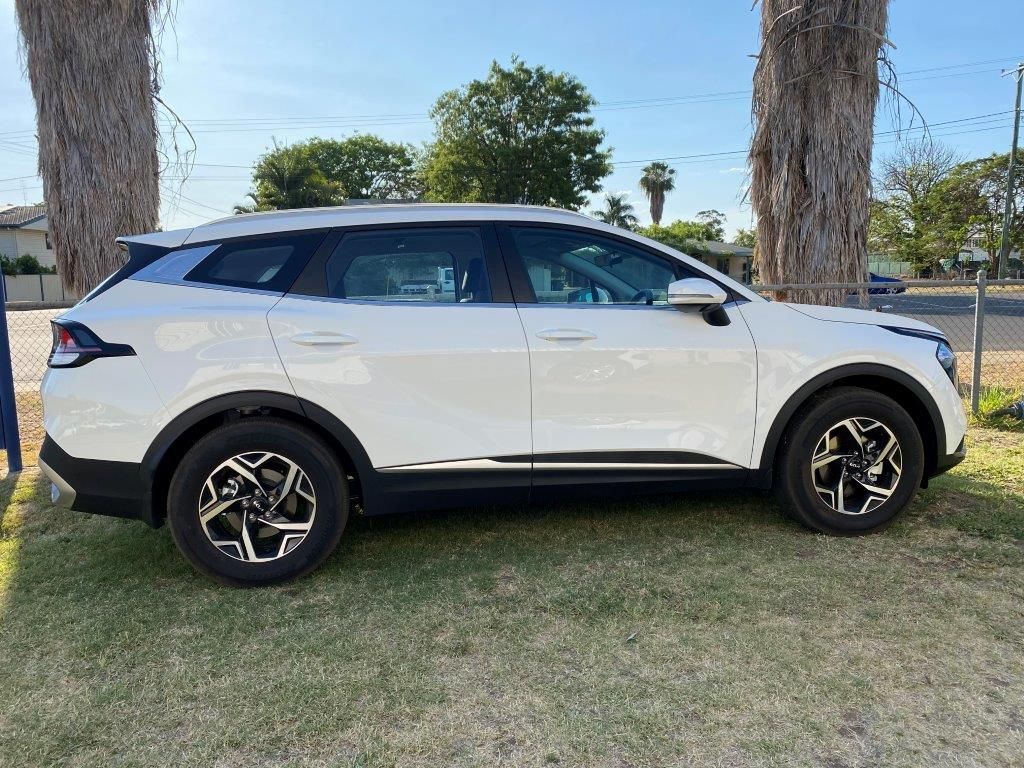 Mini Bus Driving On The Highway Past A Hill — Locqal Car Truck Trailer Rentals in Emerald, QLD