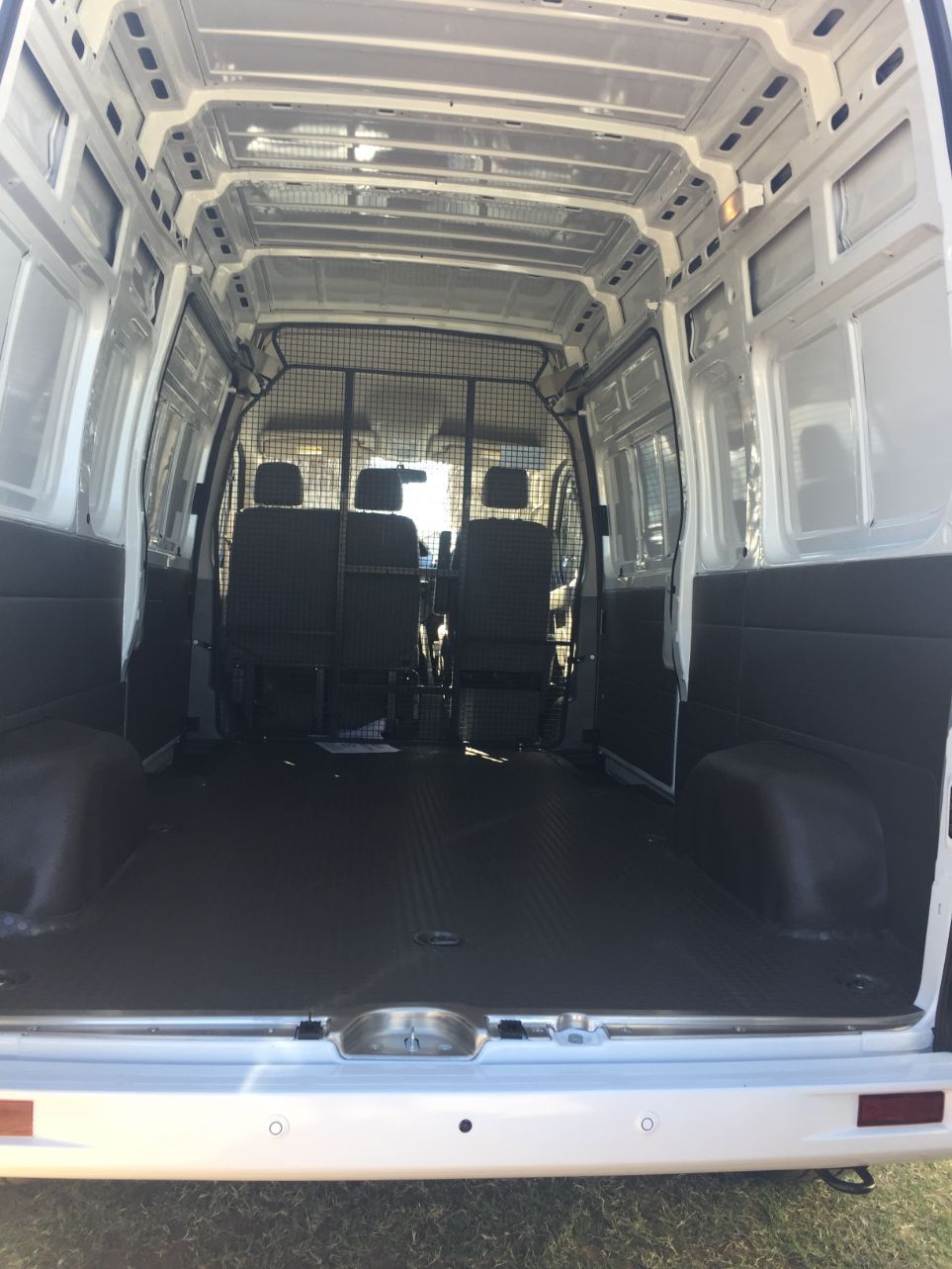 The Inside of a White Van With the Back Door Open — Locqal Car Truck Trailer Rentals in Emerald, QLD