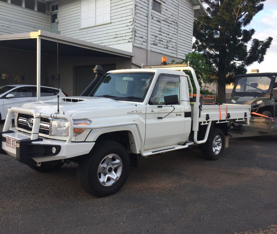 A White Truck is Parked in Front of a House — Locqal Car Truck Trailer Rentals in Emerald, QLD