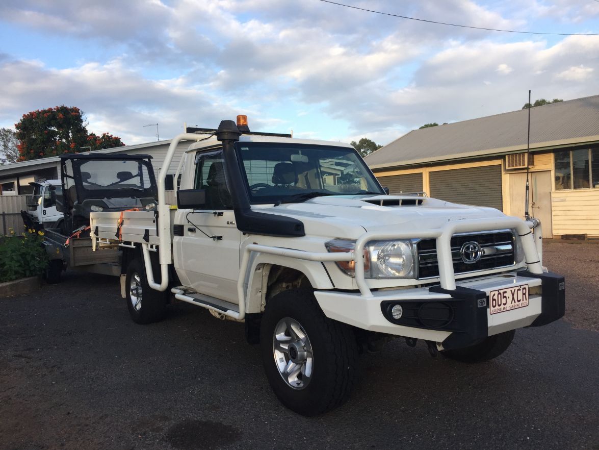 A White Truck is Parked in Front of a Building — Locqal Car Truck Trailer Rentals in Emerald, QLD