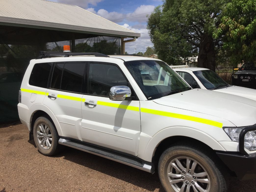 A White SUV on the Side is Parked in Front of a Building — Locqal Car Truck Trailer Rentals in Emerald, QLD