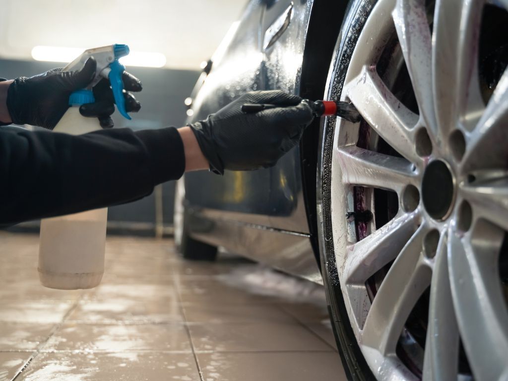 wheel being cleaned before detailing