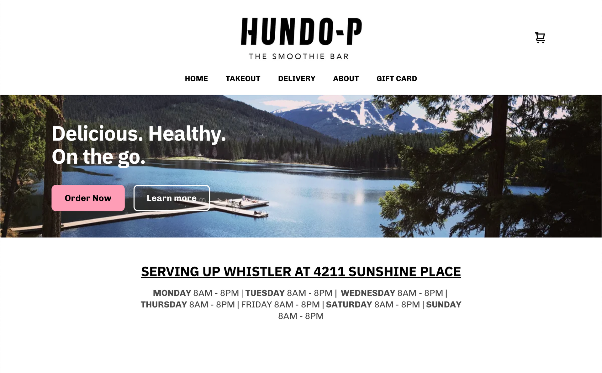 A website with a picture of a lake and mountains on it.