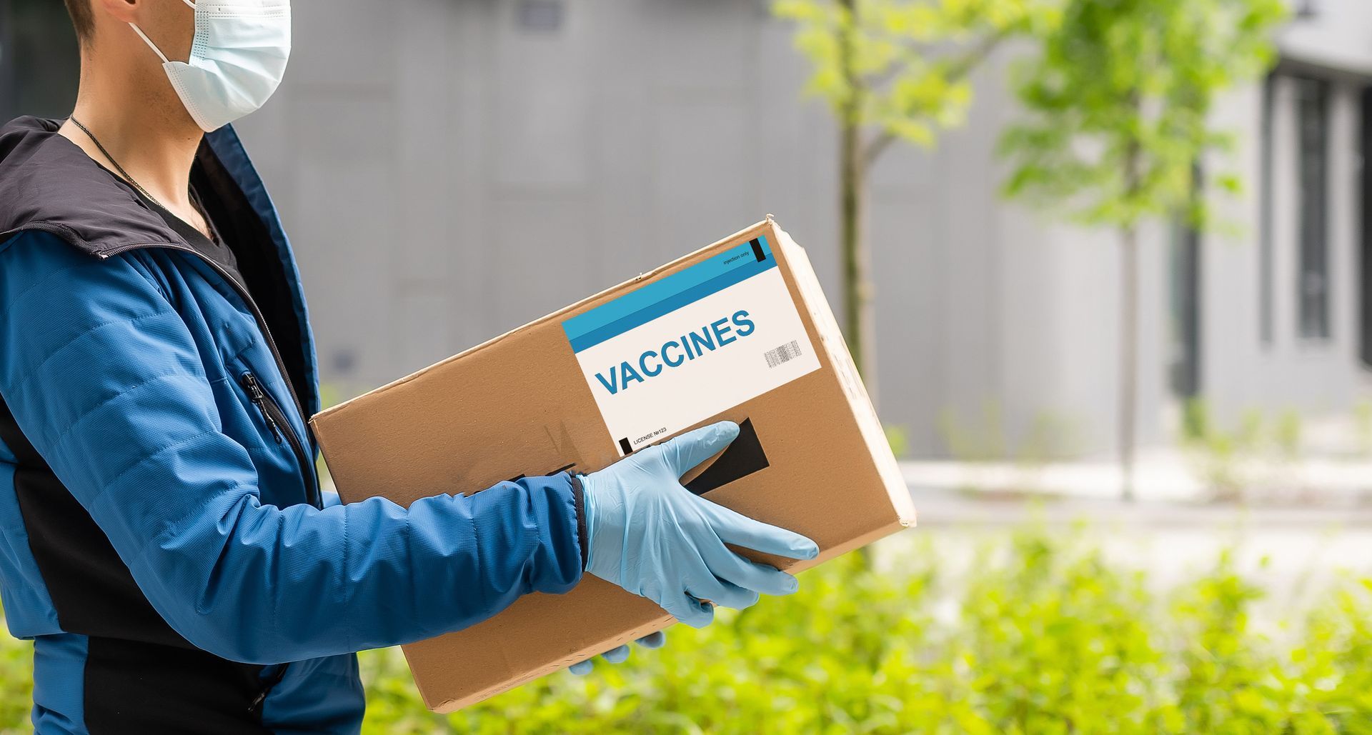 Family gathered at a dining table in a kitchen. They are eating and talking together.