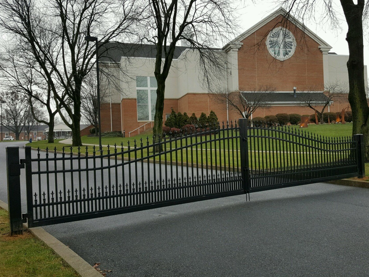 Security gates and driveway spikes from Millcreek Fence & Decks LLC