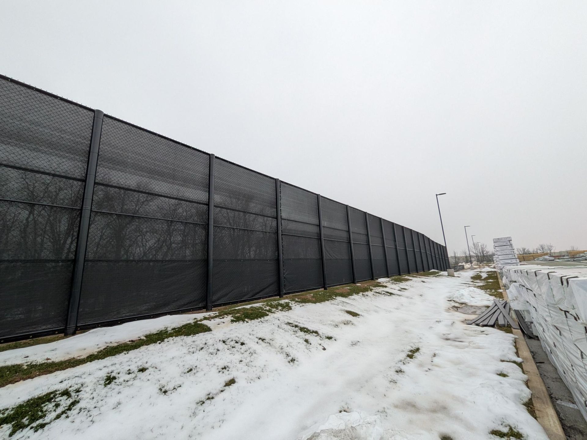 Black chain link fence installation at Wolf Distribution in York PA