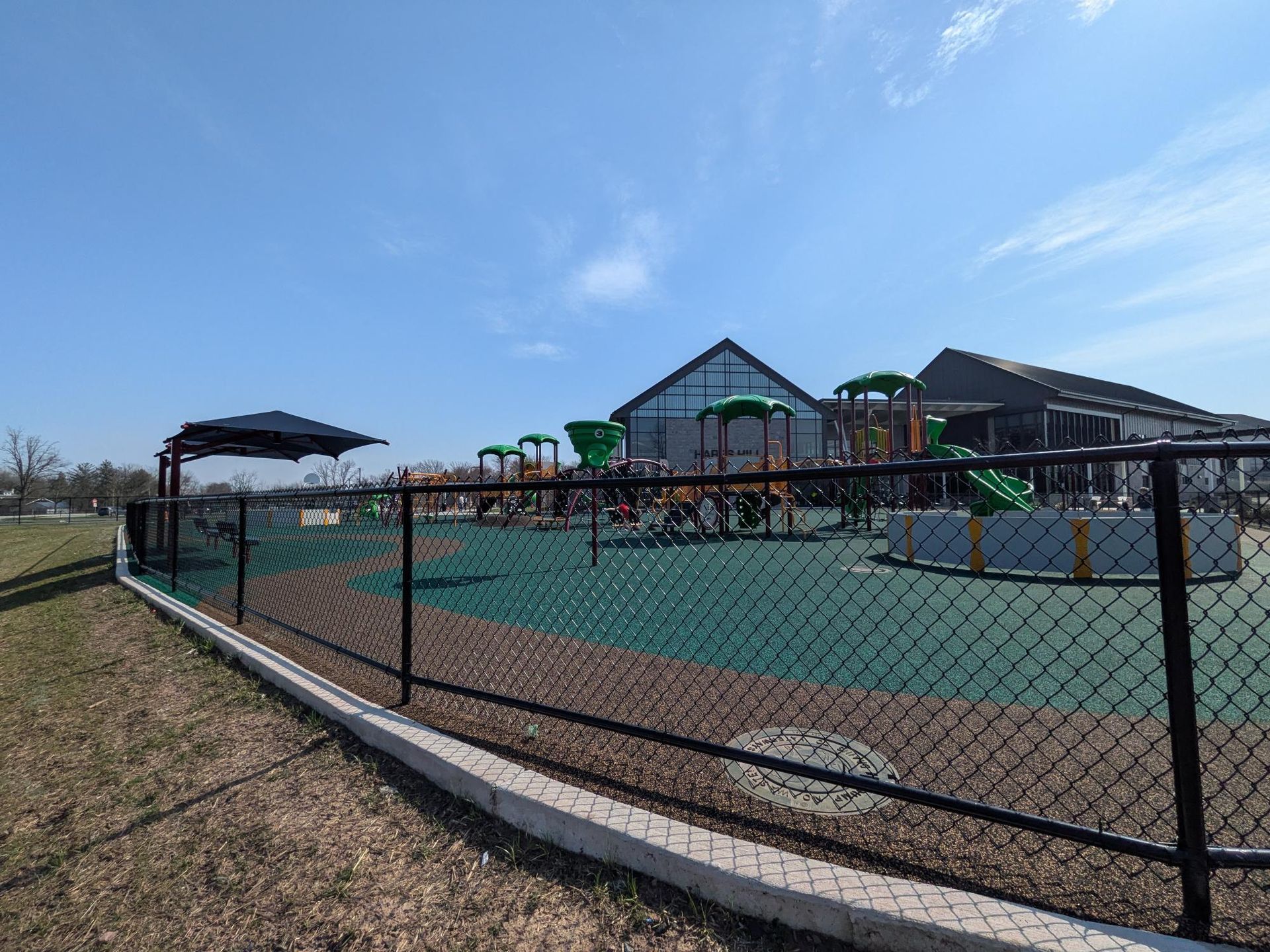 Commercial chain link fence installation for playground
