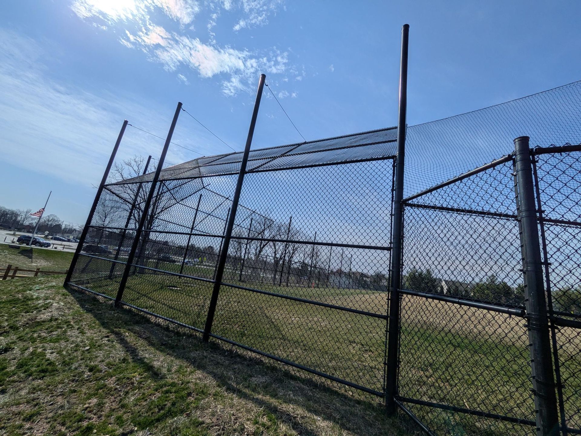 Commercial chain link fence installation for playground and ball field