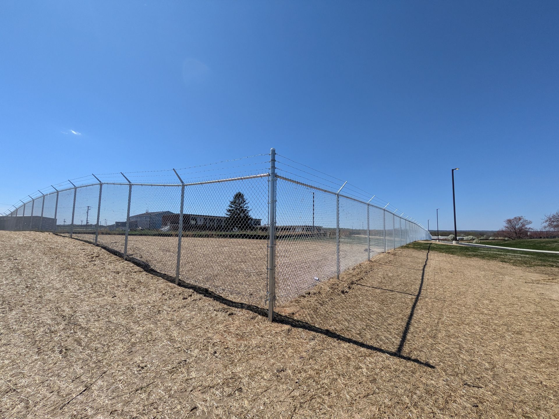 Chain link fencing installation by Millcreek Fence & Decks | Army National Guard Facility