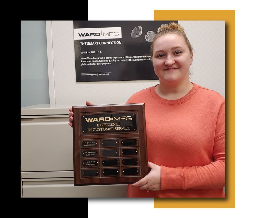 Picture of a Customer Service Representative holding the WARDMFG Excellence in Customer Service plaque.
